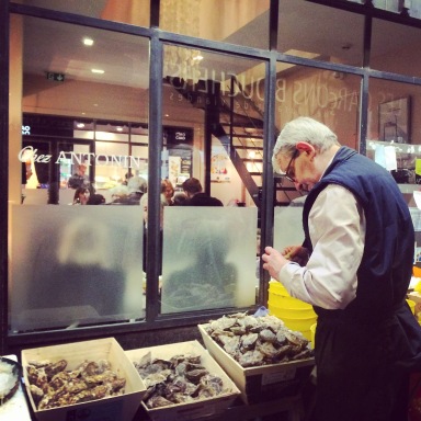 Shucking oysters at Les Halles